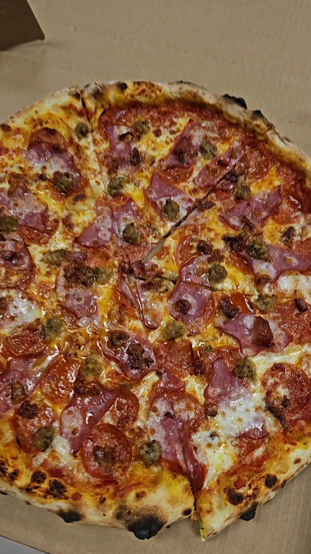 Rollin' 2 Stoned pizza with branded service materials
